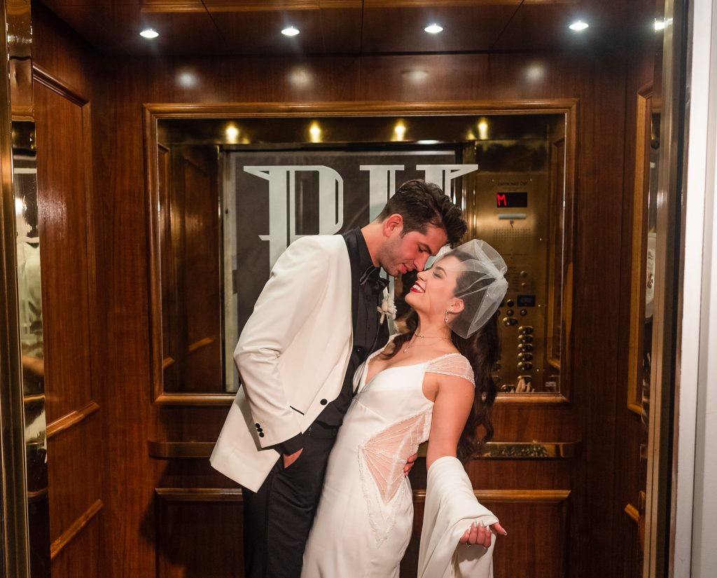 Bride and groom inside the beautiful 20's style elevator at the Read House.